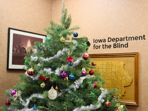 Decorated Holiday tree inside the Iowa Department for the Blind office.