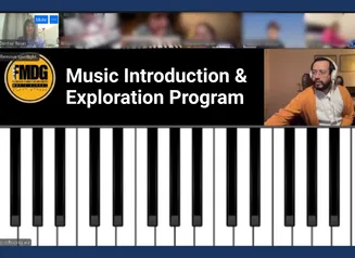 A virtual meeting with a large piano keyboard and the words 'Music Introduction & Exploration'